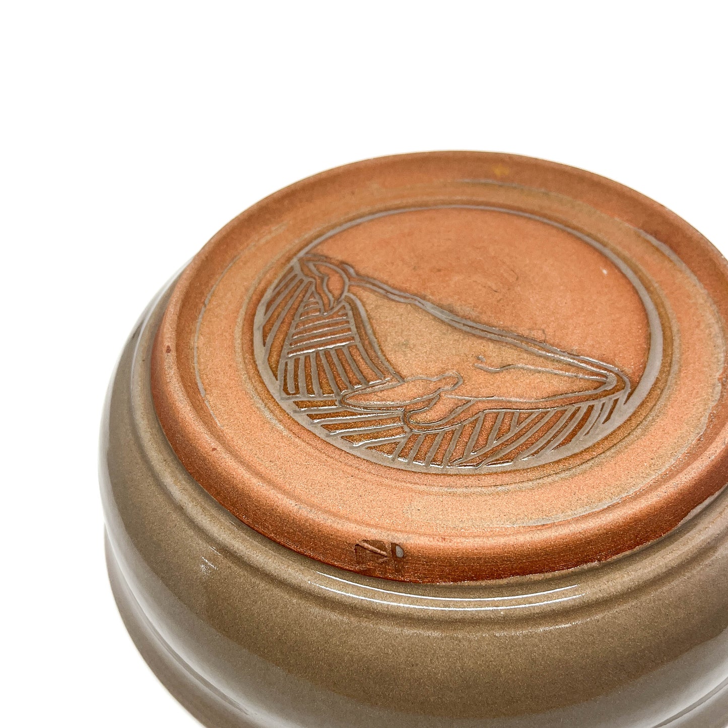 Side profile of a glazed ceramic bowl with subtle variations in tone and a slightly flared rim.