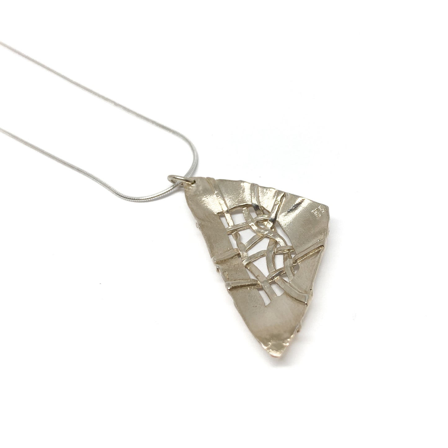 A silver pendant necklace with a triangular design and woven silver details. The pendant hangs from a delicate silver chain.