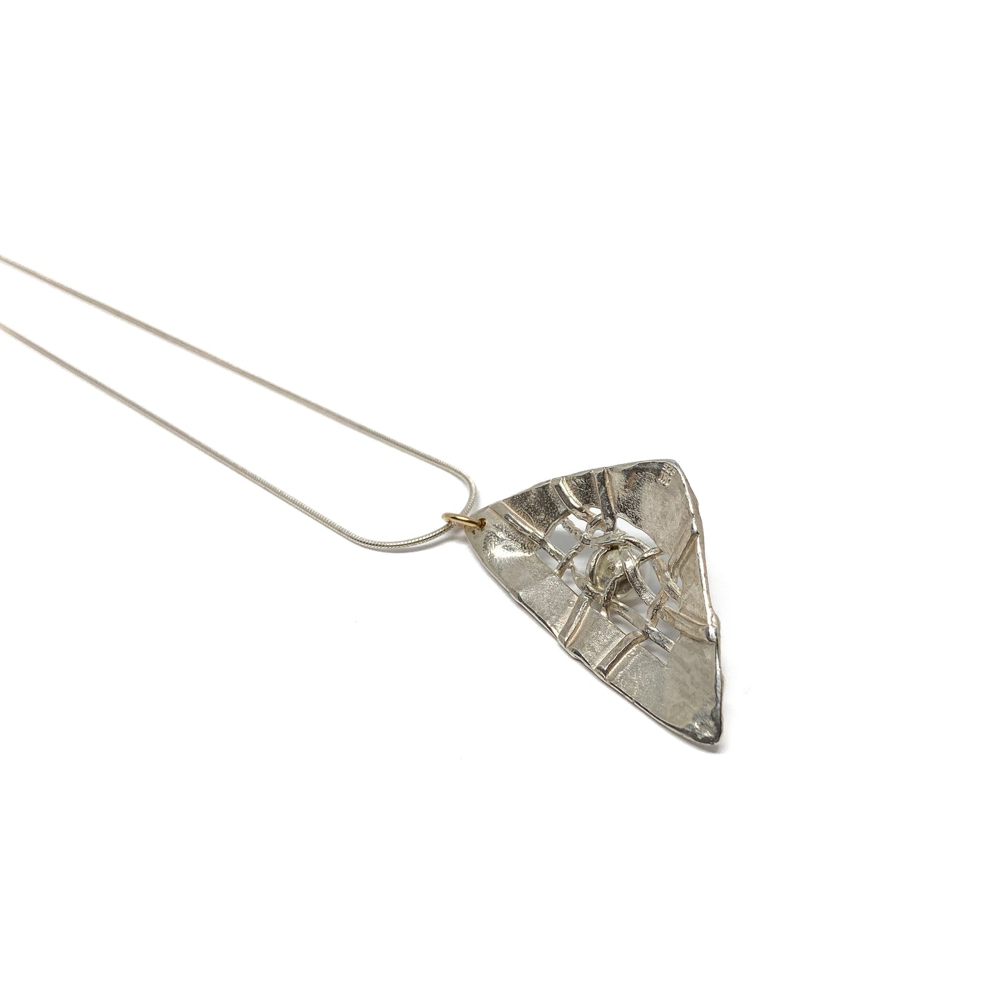 A silver pendant necklace with a triangular design and a central pearl accent. The pendant hangs from a delicate silver chain.