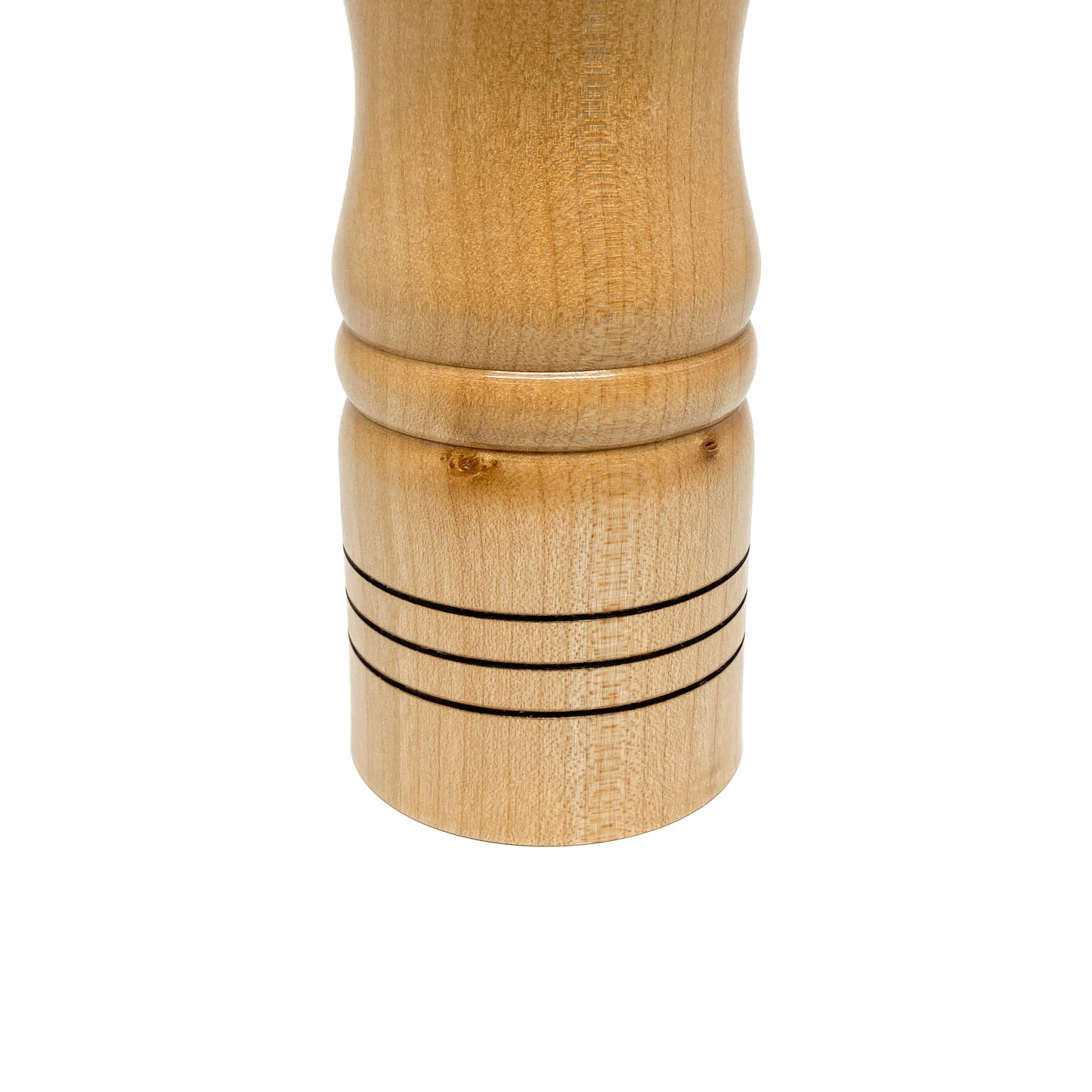 Wooden pepper mill base, light wood with ring details, close-up.