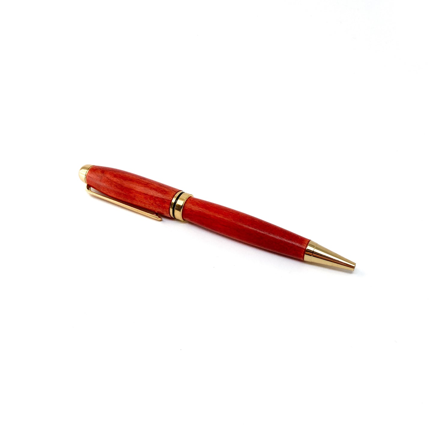 Red wood pen with gold trim.