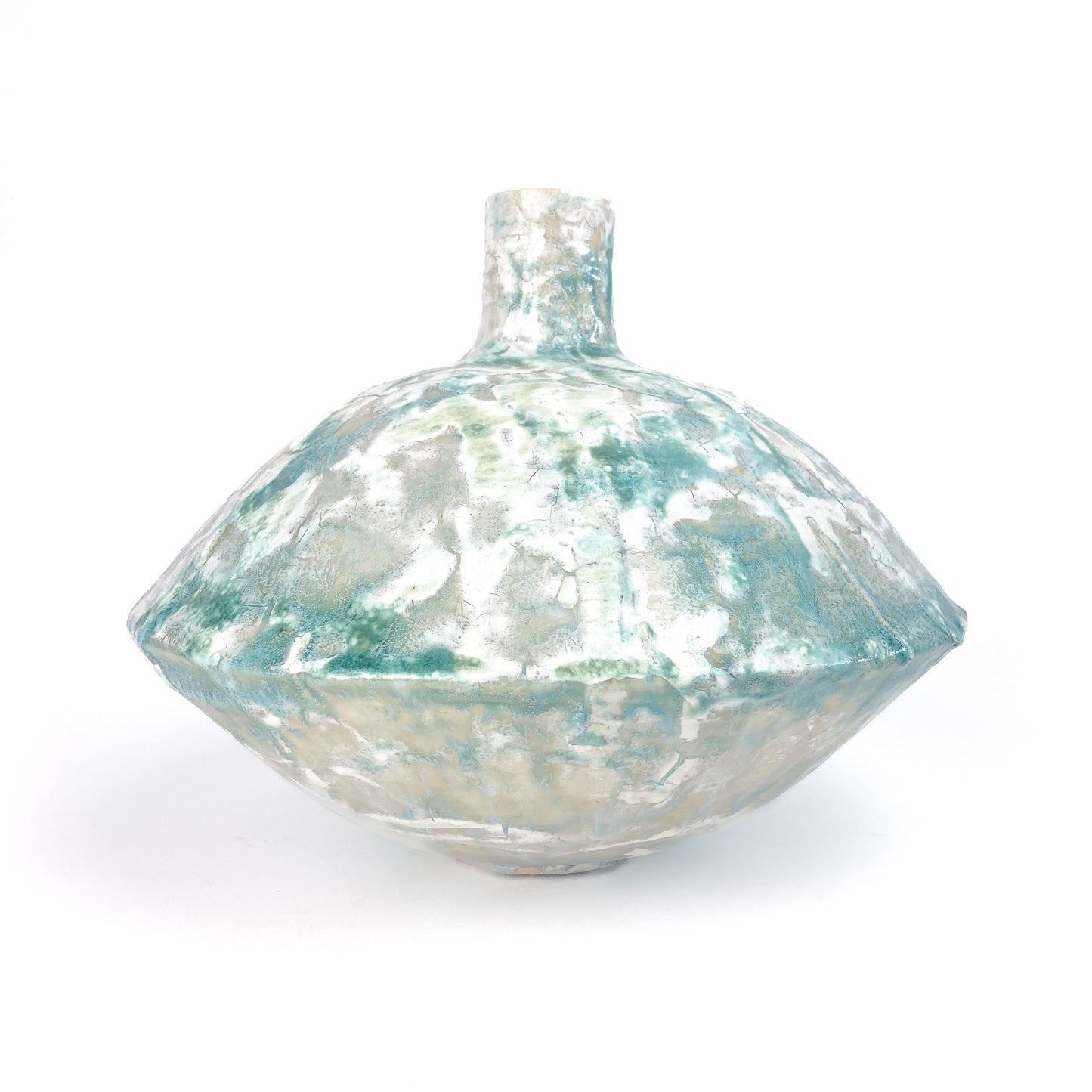 A textured ceramic UFO vessel by Iraj Dashti-Laali with a narrow neck and a mottled teal and light beige crackled glaze.