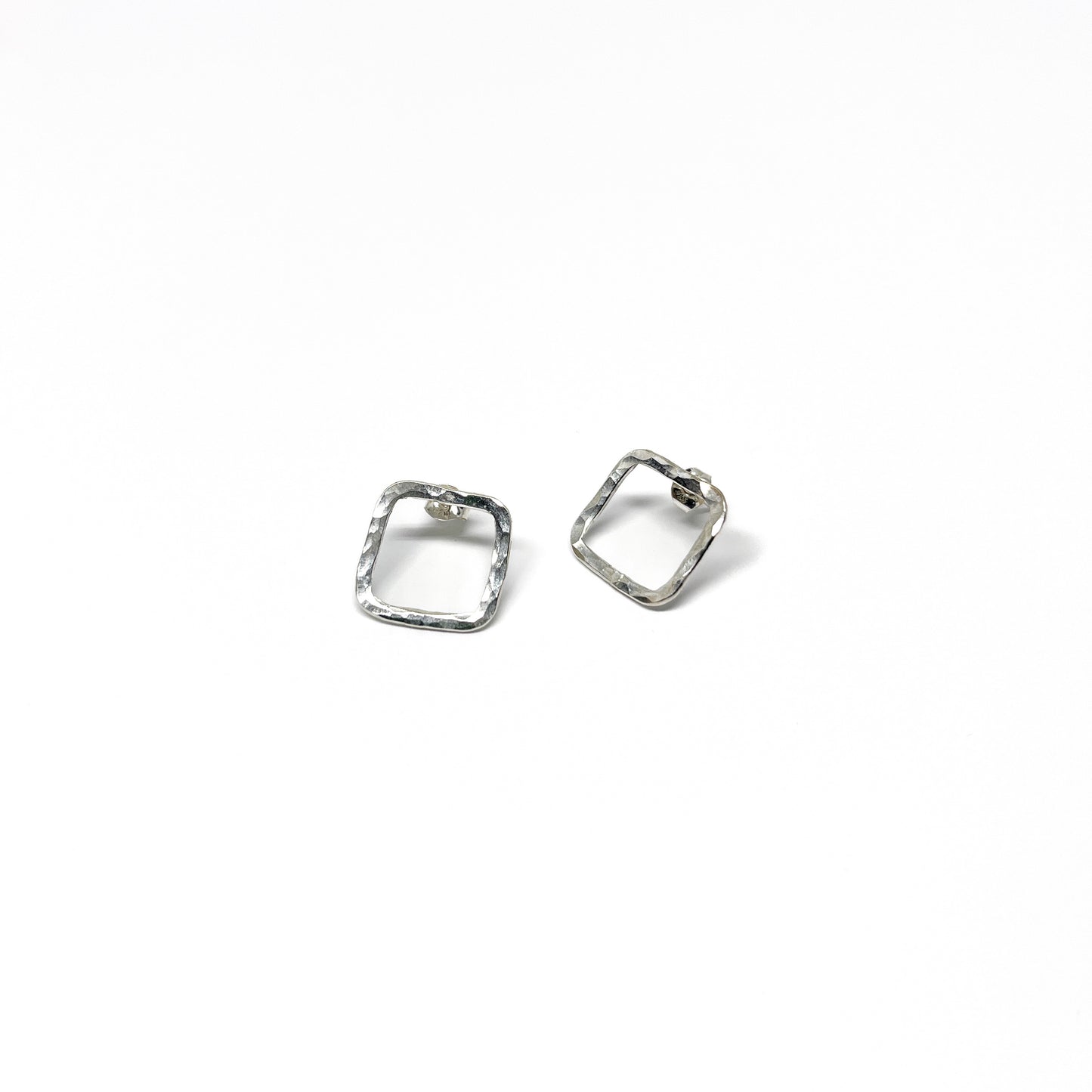 Hammered square earrings, textured metal.