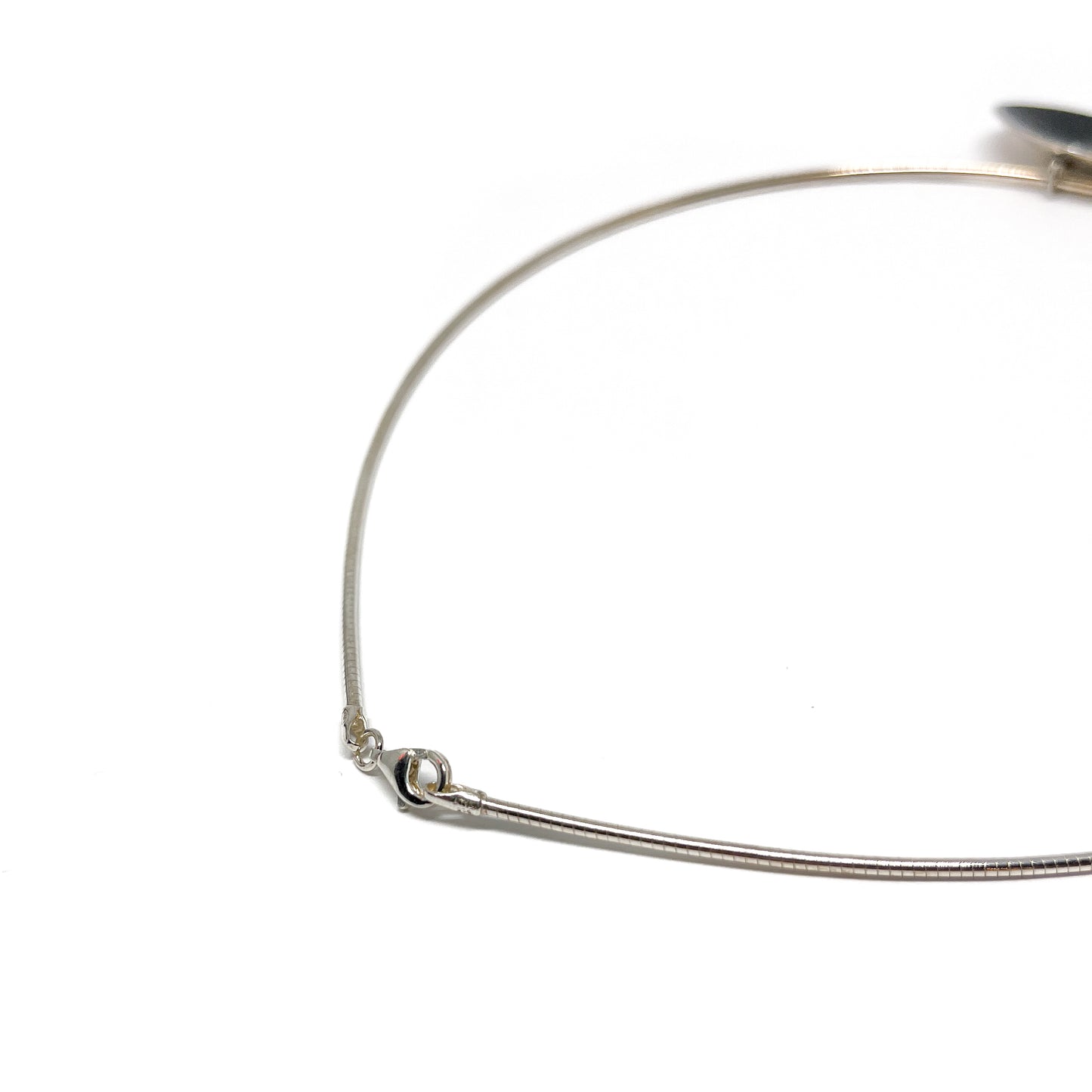 Detail of the clasp on the silver Moonspace Pendant Necklace.