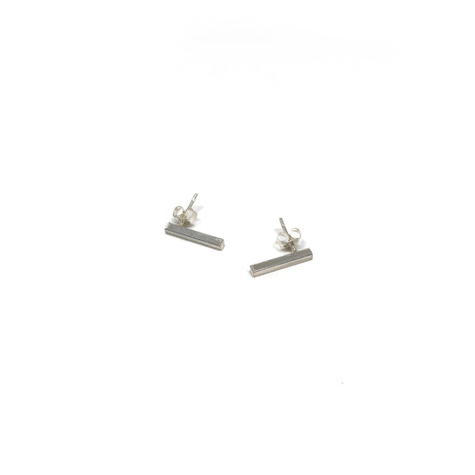 Two silver Twigs Studs earrings with push-back closures are displayed on a white surface.