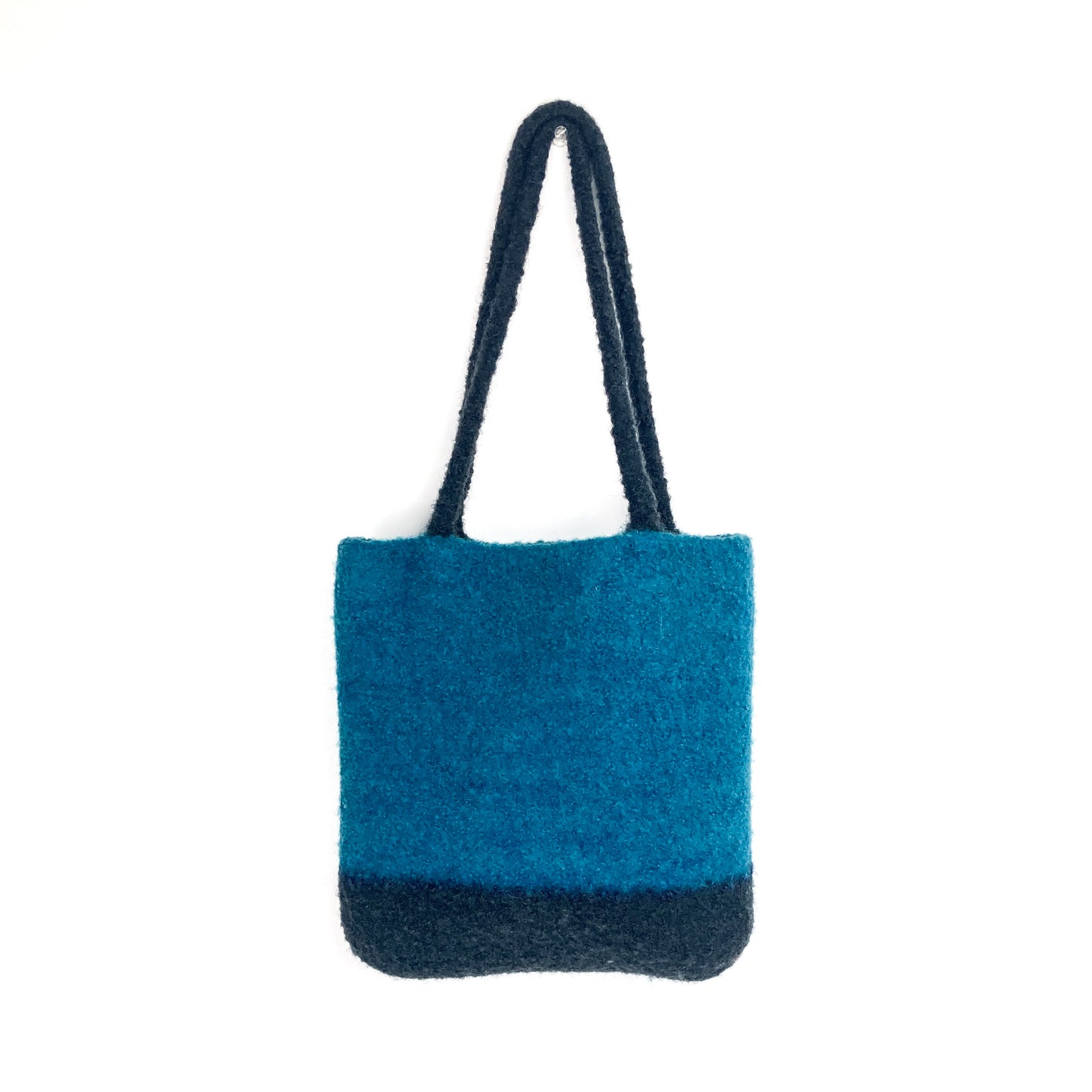 Two-tone felted tote bag with two thick, looped handles. The main body of the bag is a vibrant color.