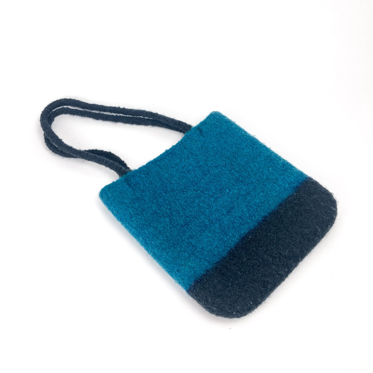 Two-tone felted tablet tote bag with two thick, looped handles. The main body is a vibrant color.