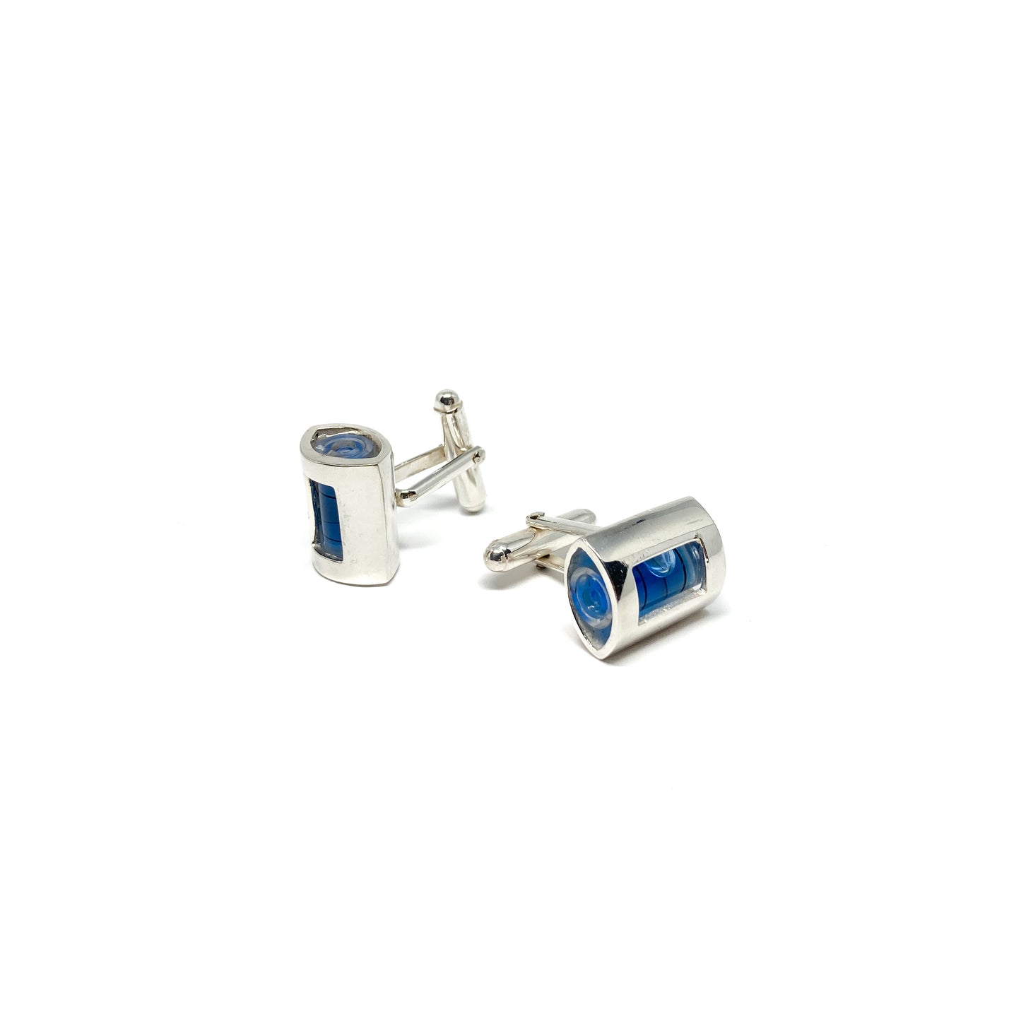 A pair of Even Design Level Cufflinks. Silver-toned with miniature spirit levels containing blue liquid and air bubbles.