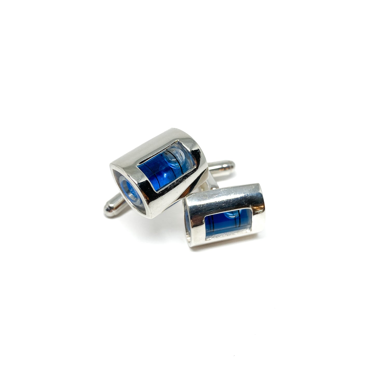 A pair of Even Design Level Cufflinks. Silver-toned with miniature spirit levels featuring blue liquid and air bubbles.