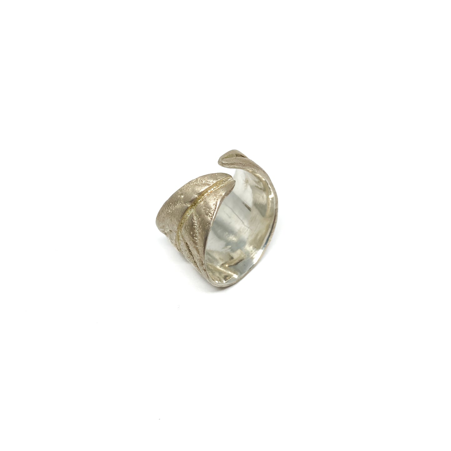 Textured silver ring with a stylized leaf motif that curves around the finger.