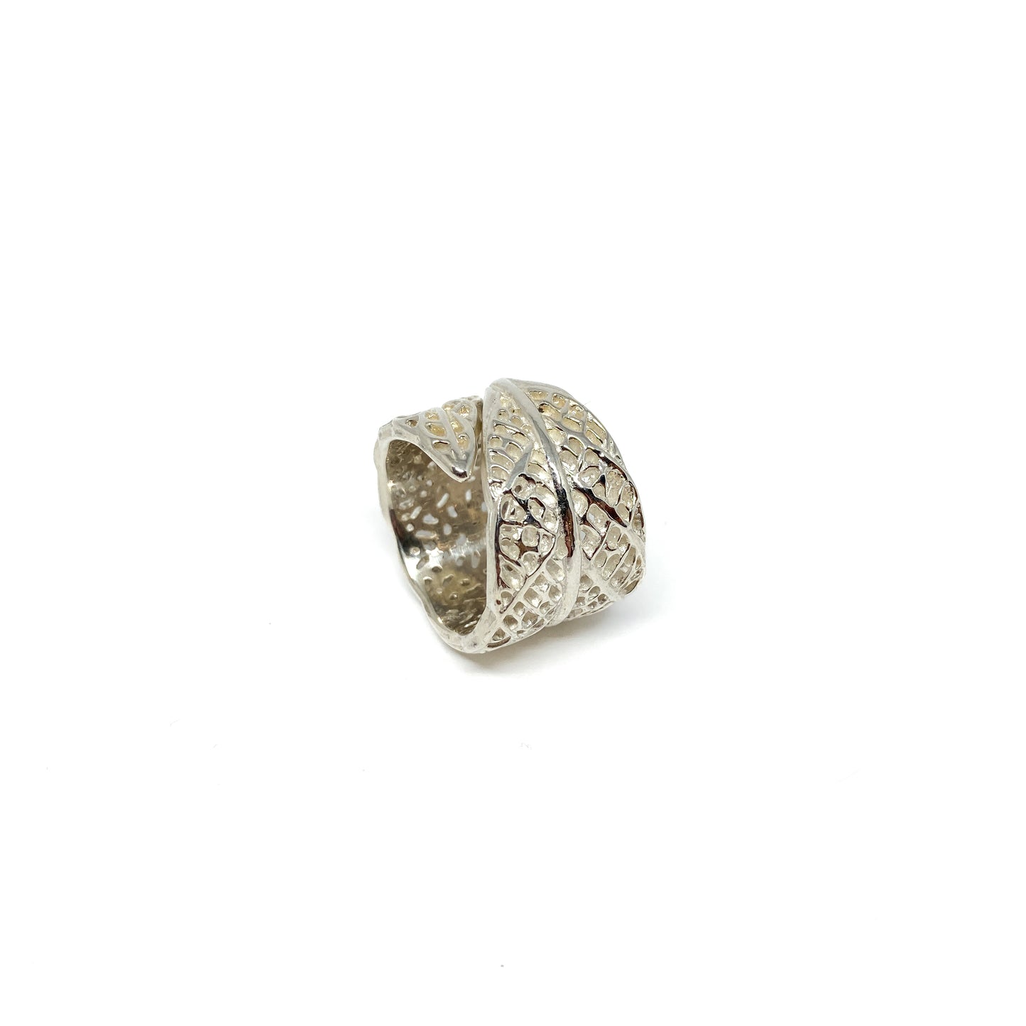 Silver ring with an openwork lace leaf design that wraps around the finger. Lace Leaf Ring.