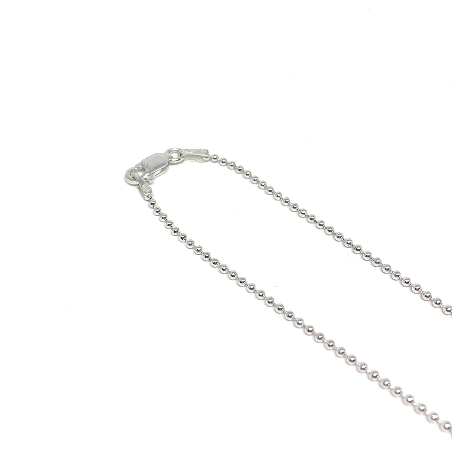 A close-up shows the lobster clasp and the small, spherical links of a sterling silver ball chain.