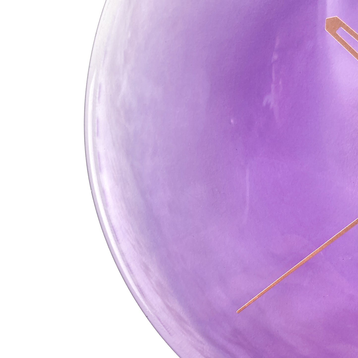 Close-up of a round purple glass clock face with a lighter center, showing a thin gold-toned second hand.