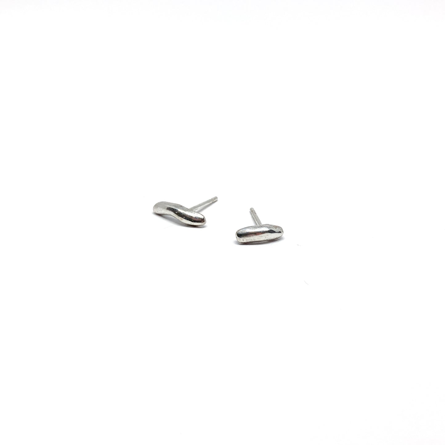 Silver organic stud earrings.