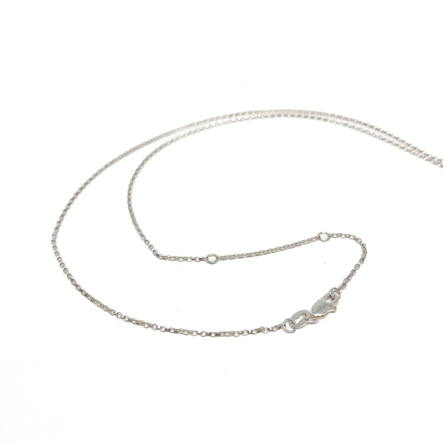 Silver necklace chain, close-up with clasp detail visible.