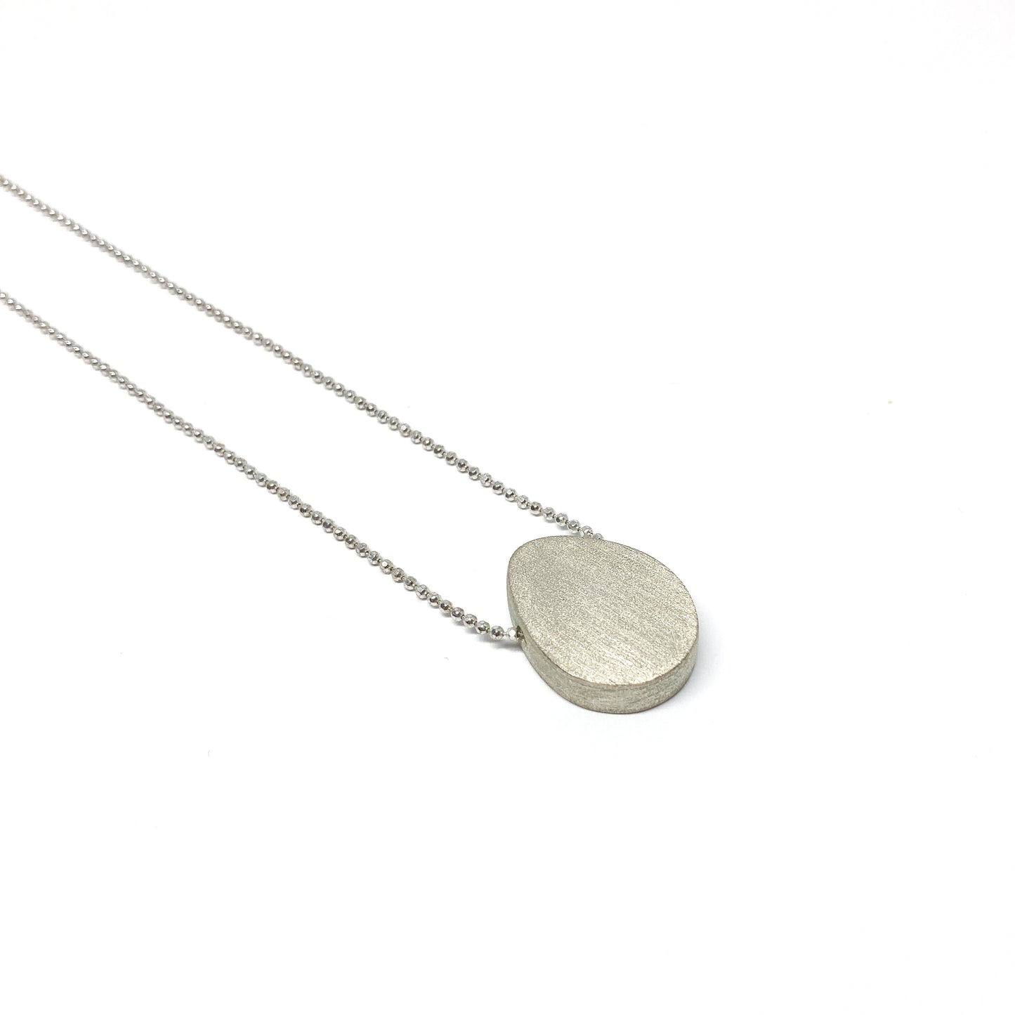 Silver boulder necklace.
