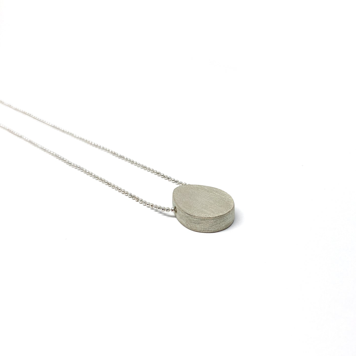 Silver boulder necklace.