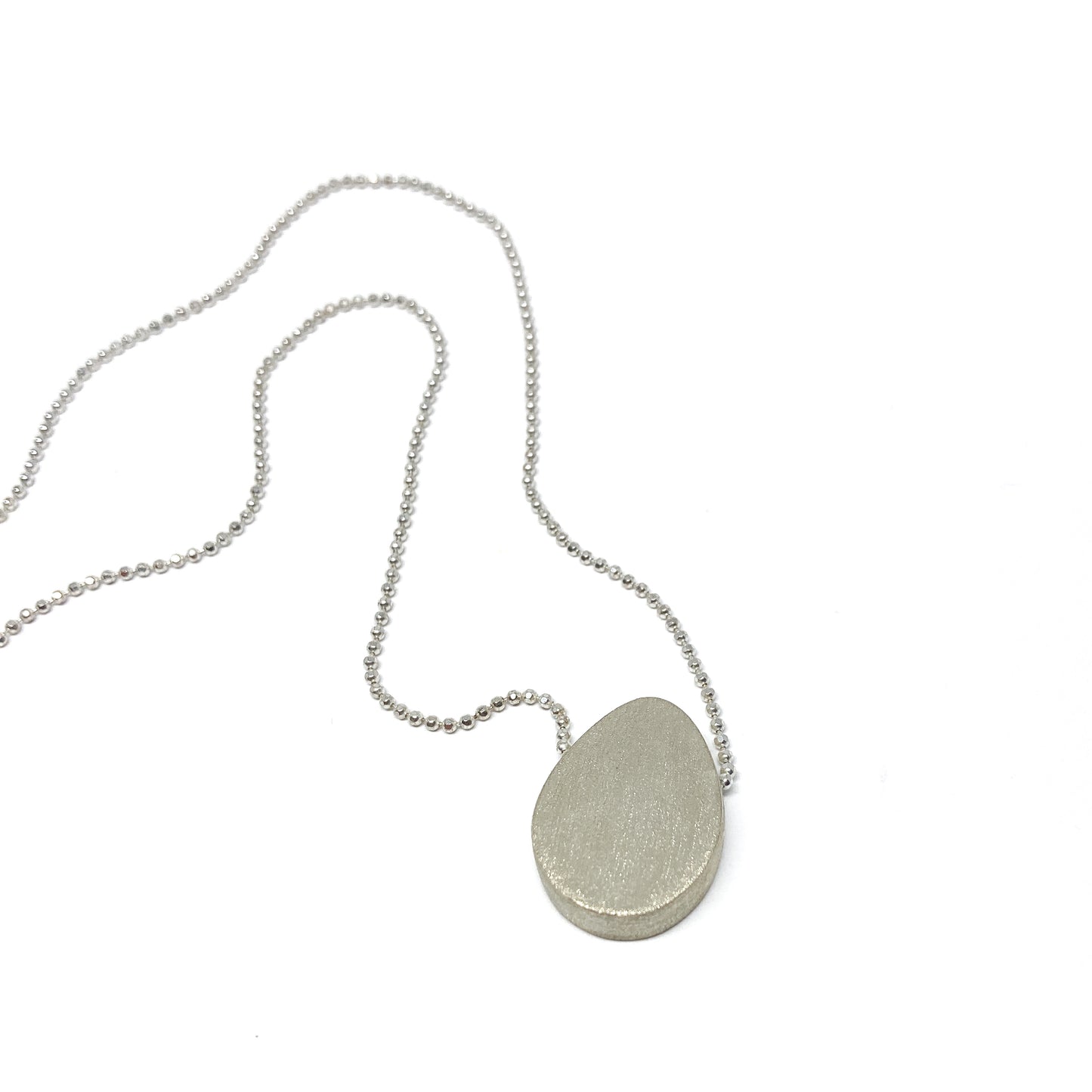 Silver boulder necklace.