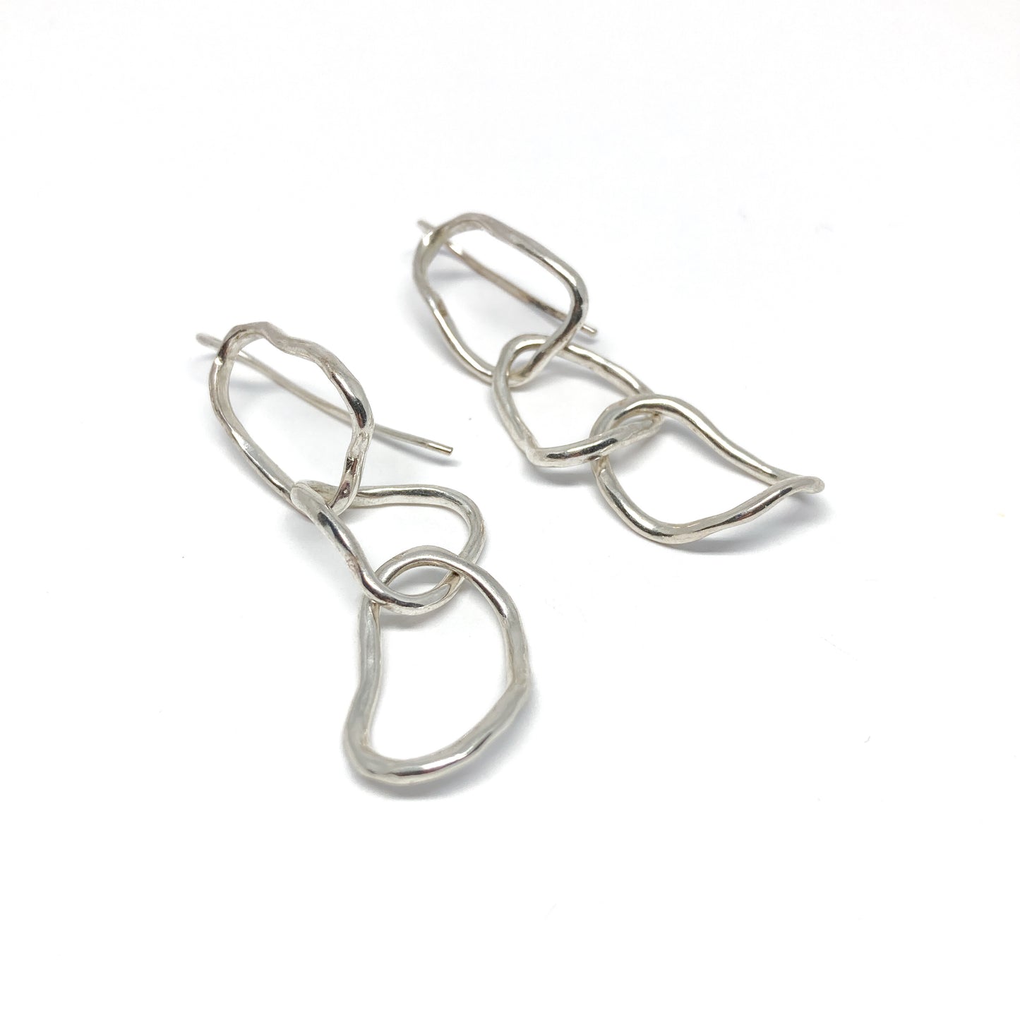 Silver organic link earrings.