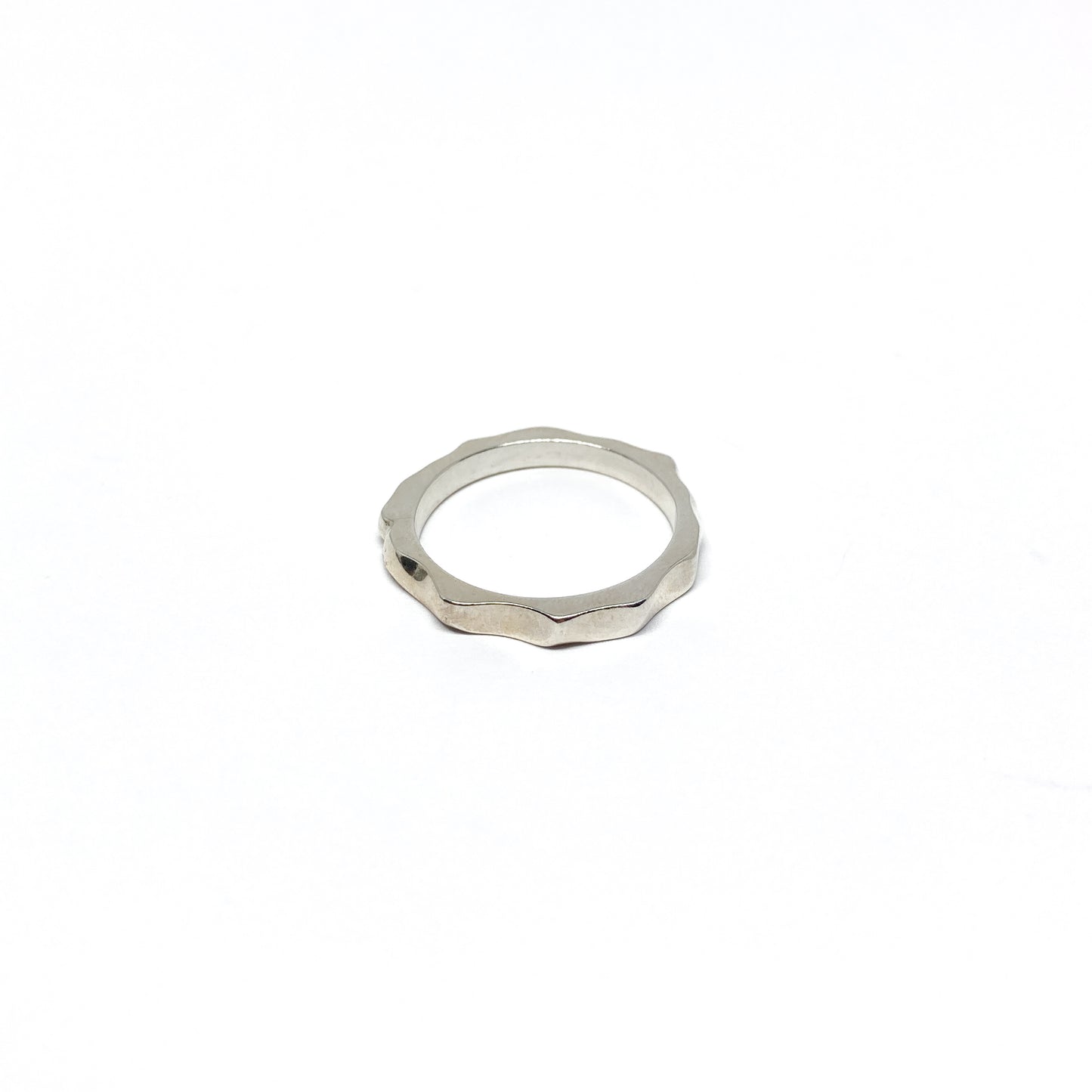 Silver textured band ring.