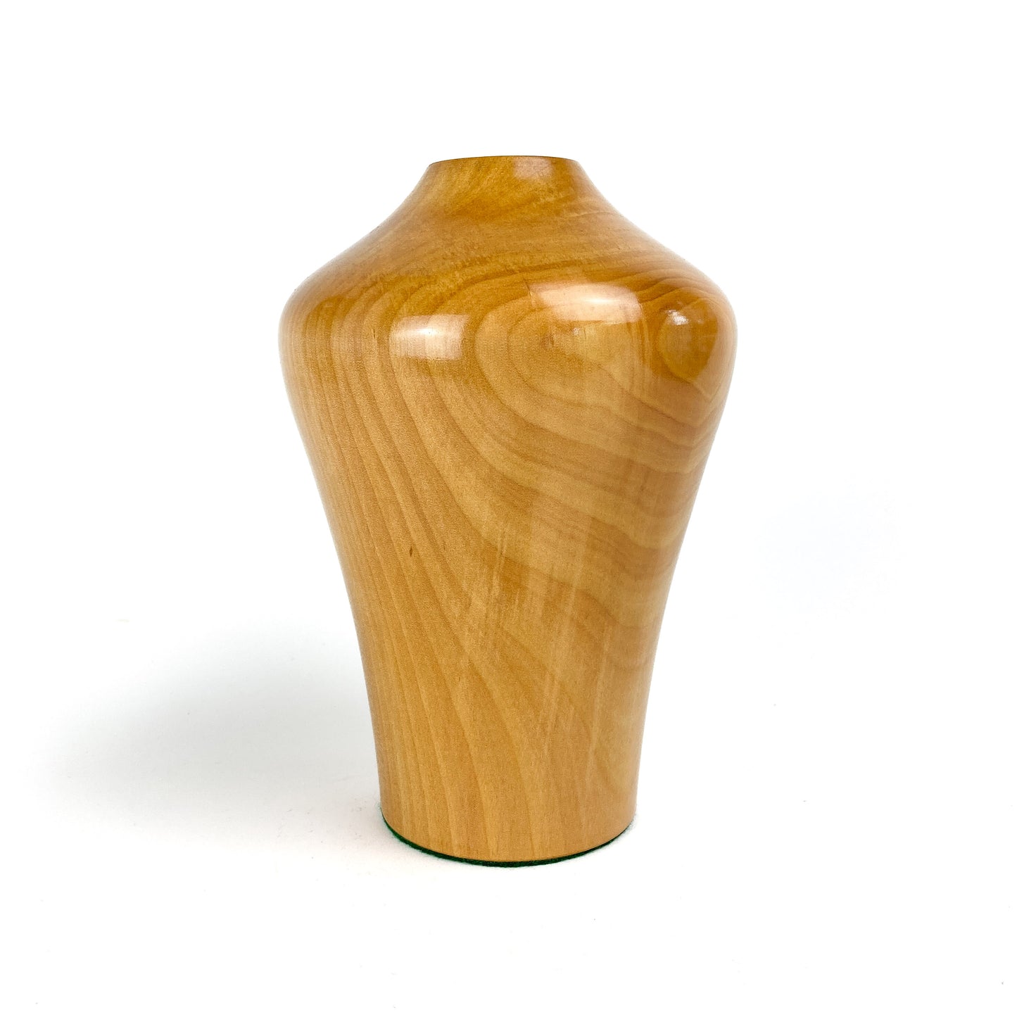 Angled view of a wooden Alder Hollowform vase with a narrow opening.