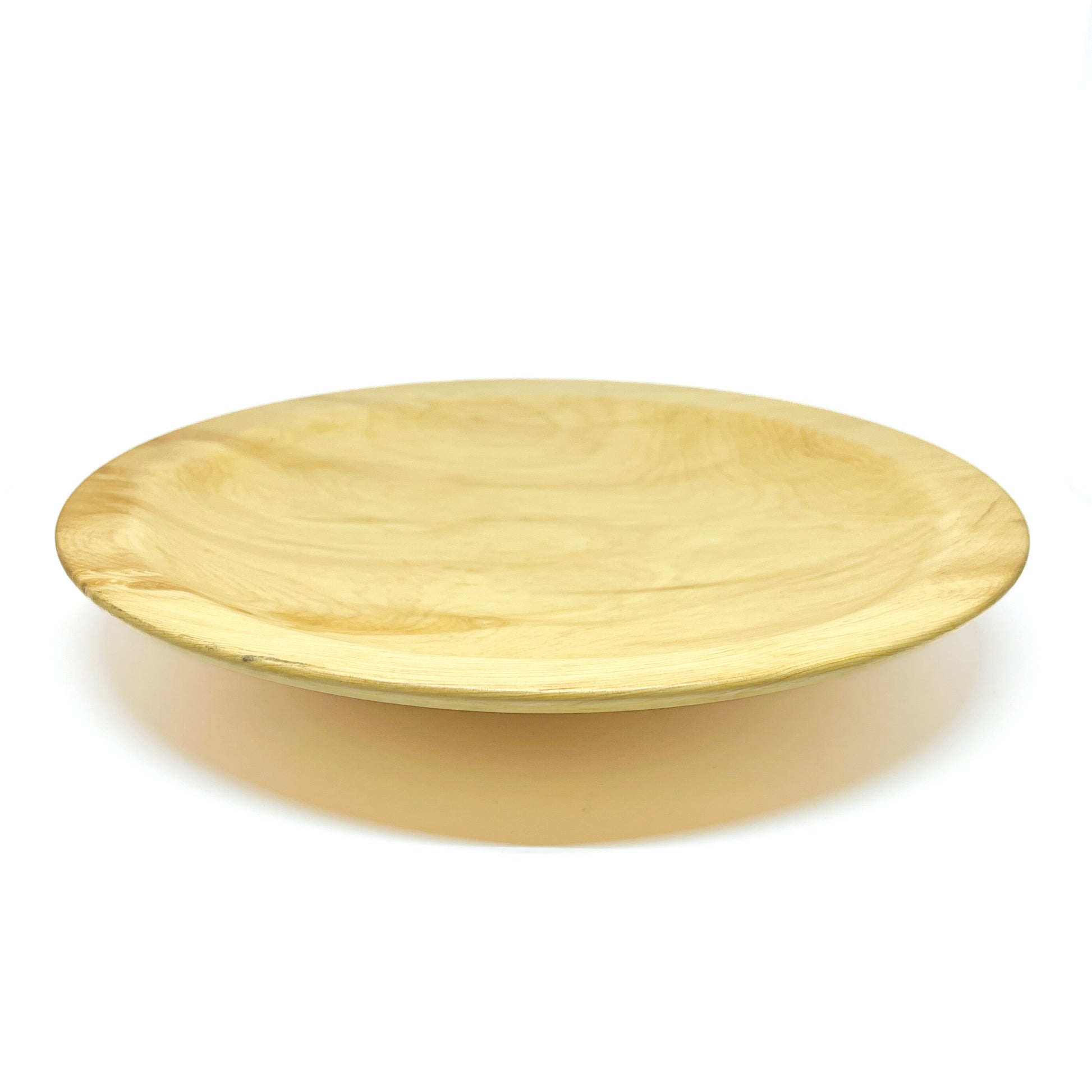 A shallow, round Yellow Cedar Platter with a smooth surface.