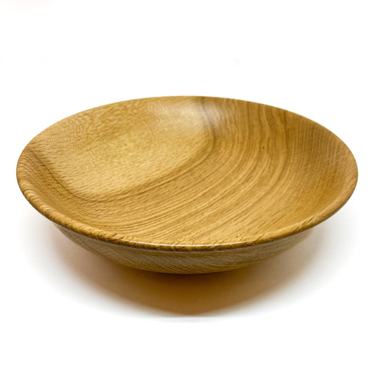A handcrafted Striped Garry Oak Bread Bowl, viewed from a slight angle showcasing its interior grain.