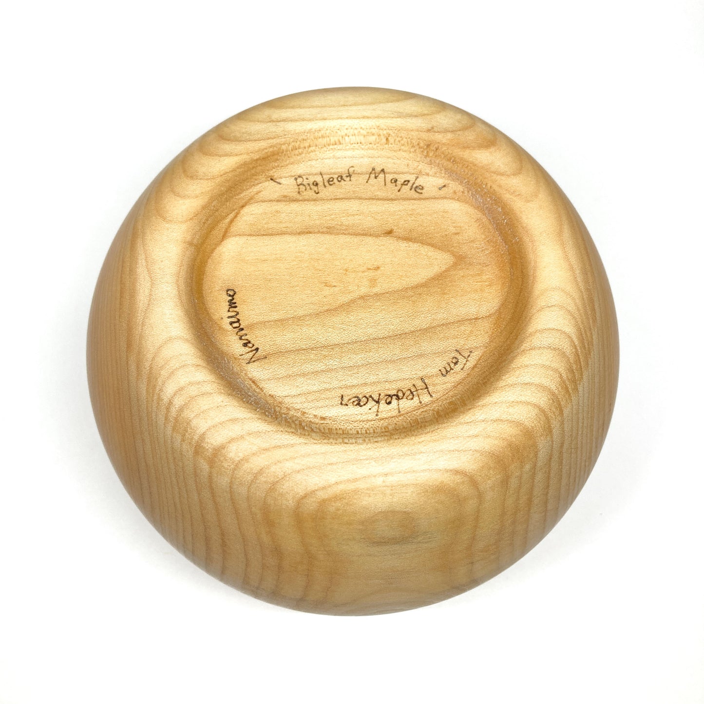 The bottom of a maple bowl.