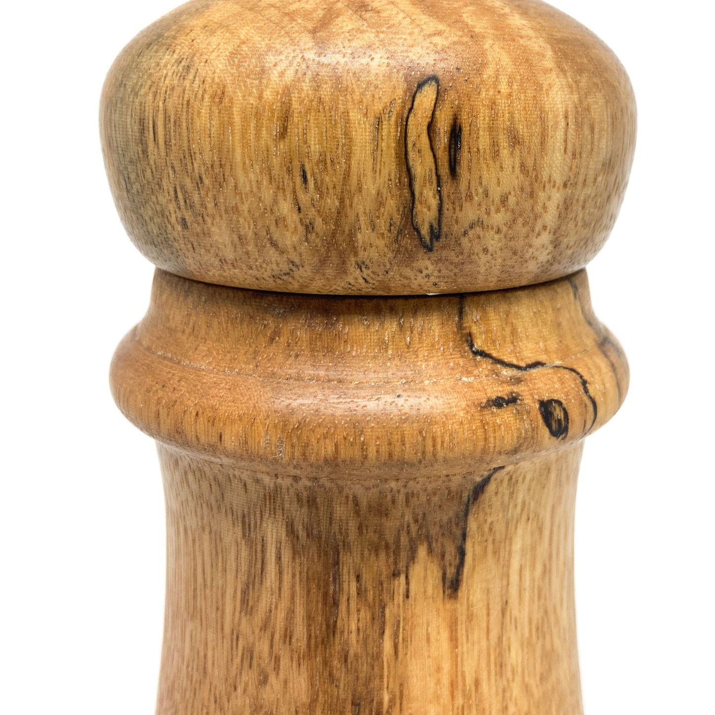 Close-up of the top and mid-section of an antique style pepper grinder.