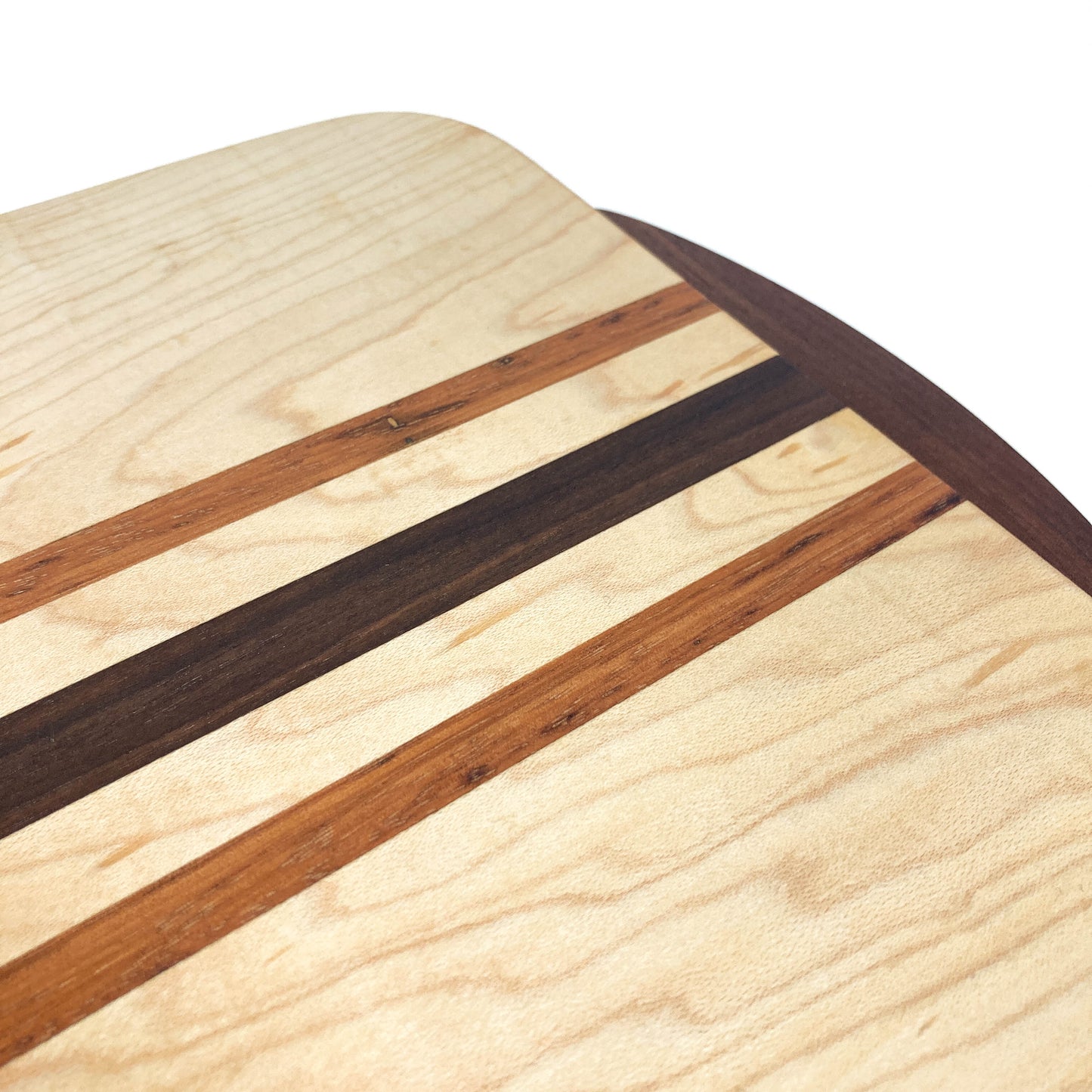 Close-up of the wood grain and striped pattern on a Striped Eastern Maple Cutting Board.