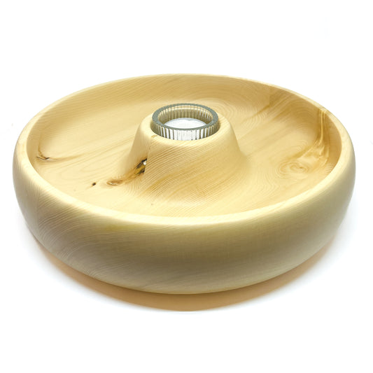 Yellow Cedar Entertaining Dish with a glass votive in the center, viewed from slightly above.