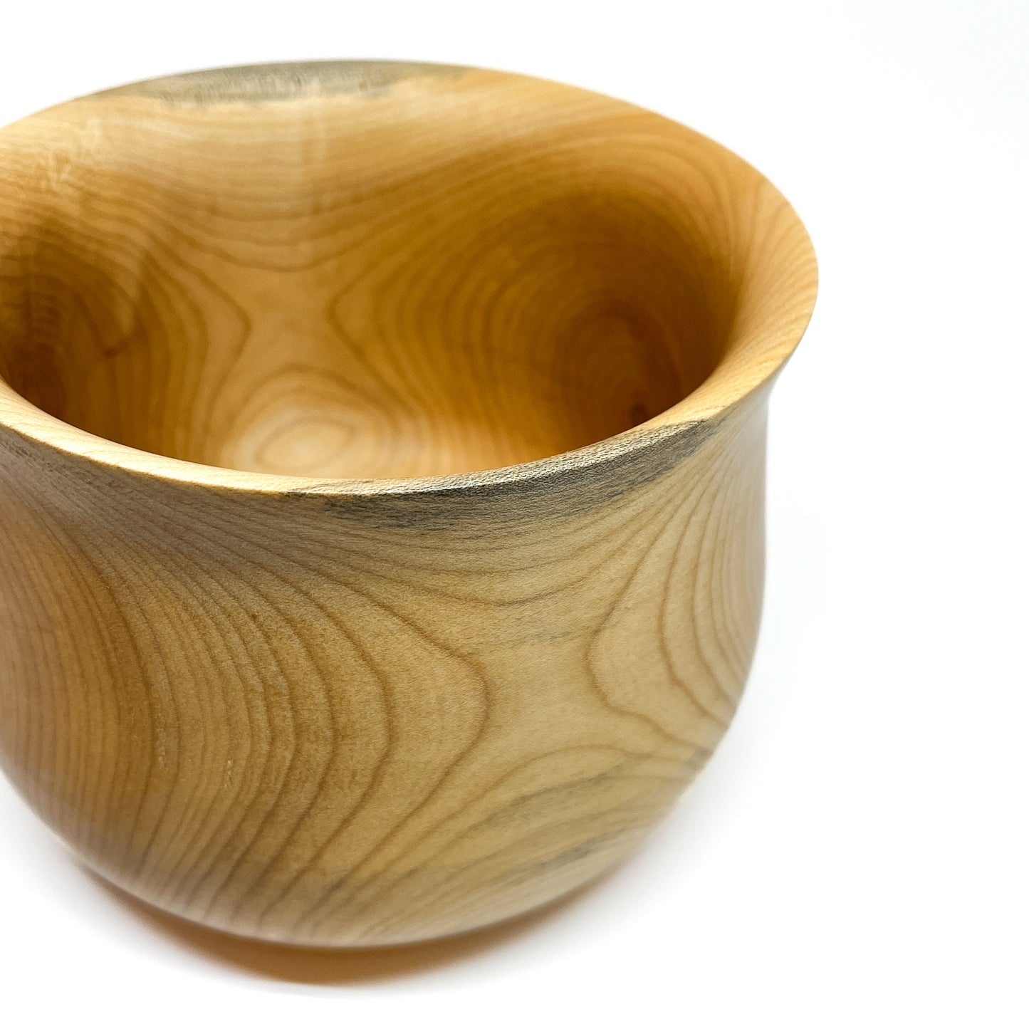Close-up of a wide Big Leaf Maple vase, focusing on the rim and distinct wood markings.