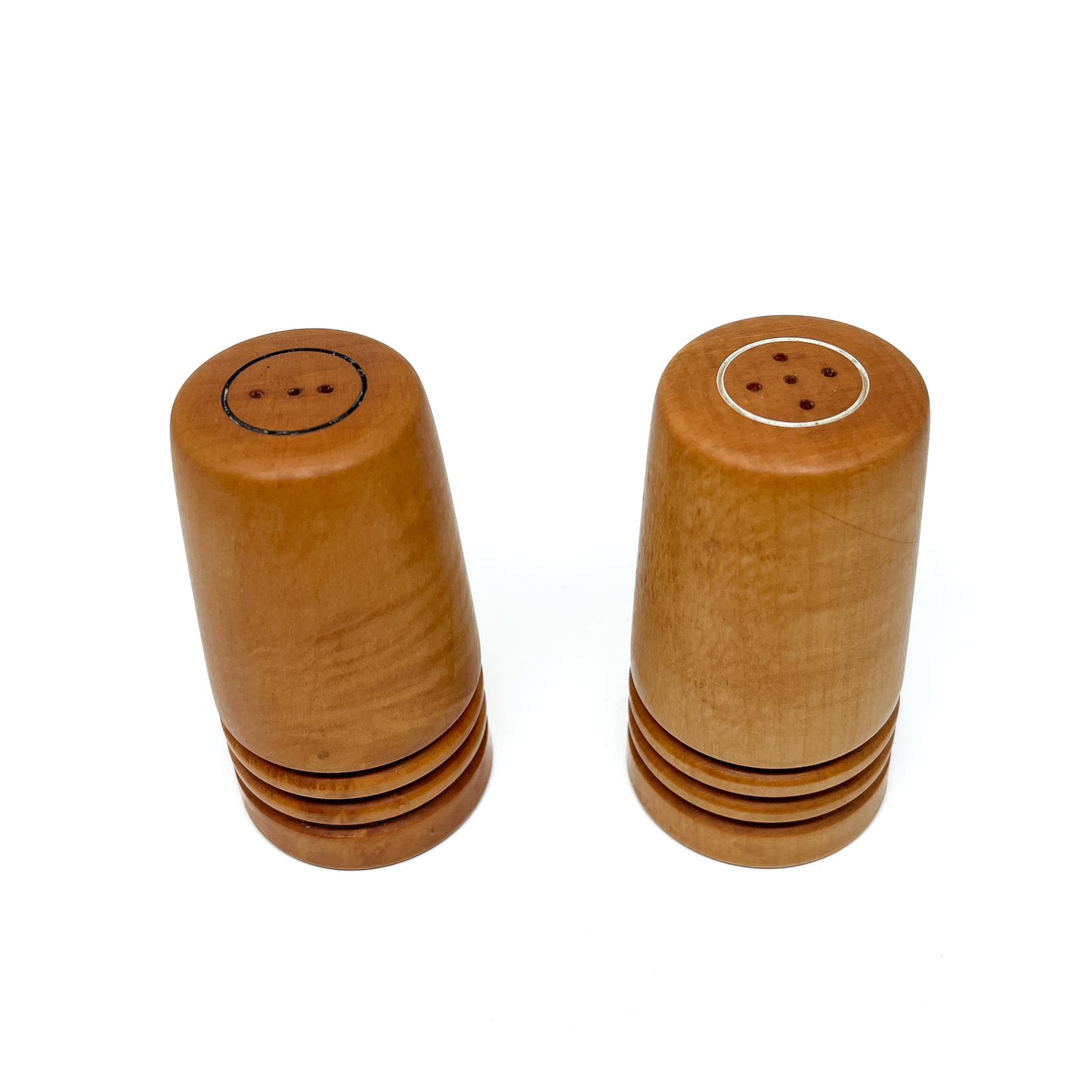 Two wooden Flared Arbutus Salt & Pepper shakers standing side-by-side, viewed from slightly above.