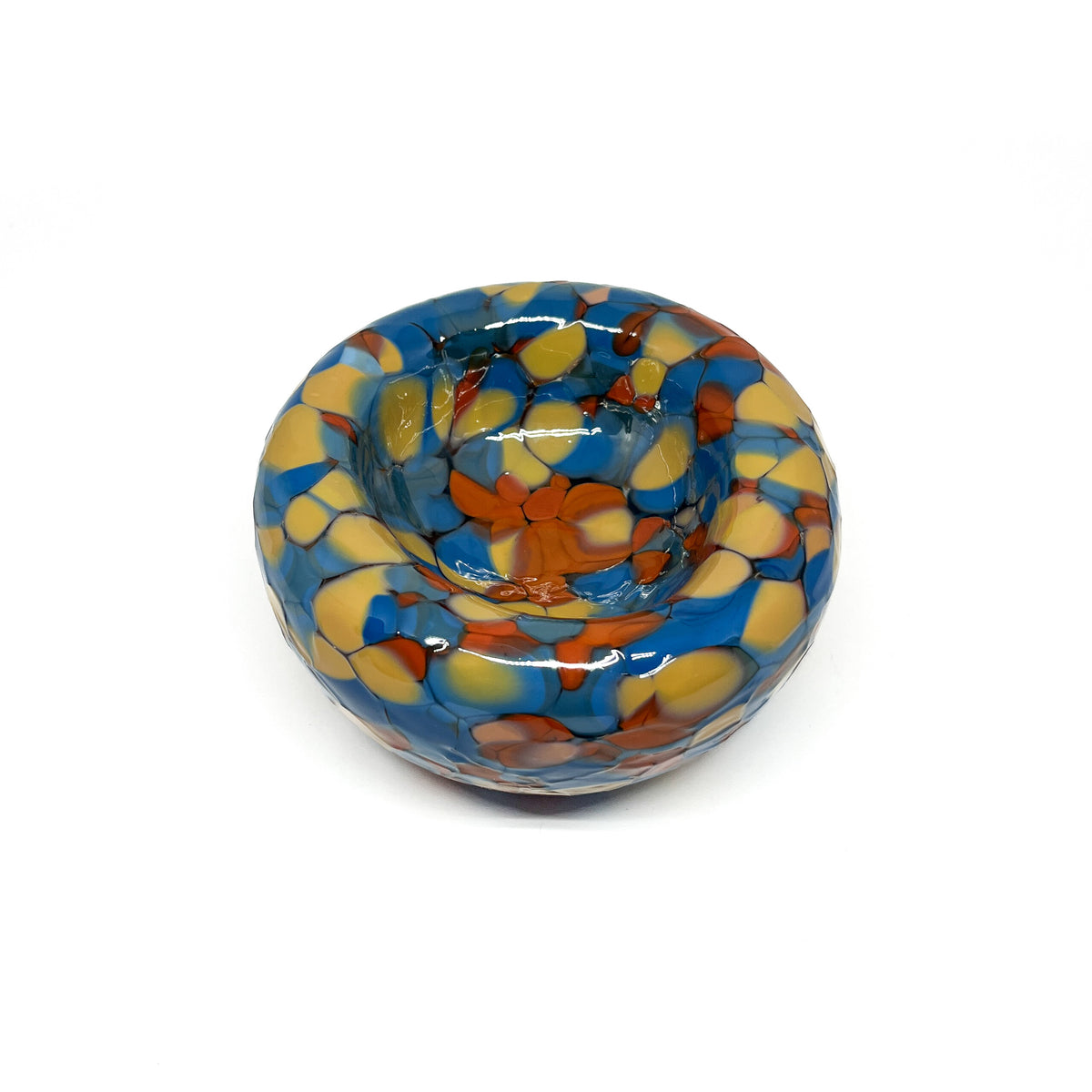 Top view of a blue-orange Blotched Nest Bowl with layered, vibrant spotted glass.