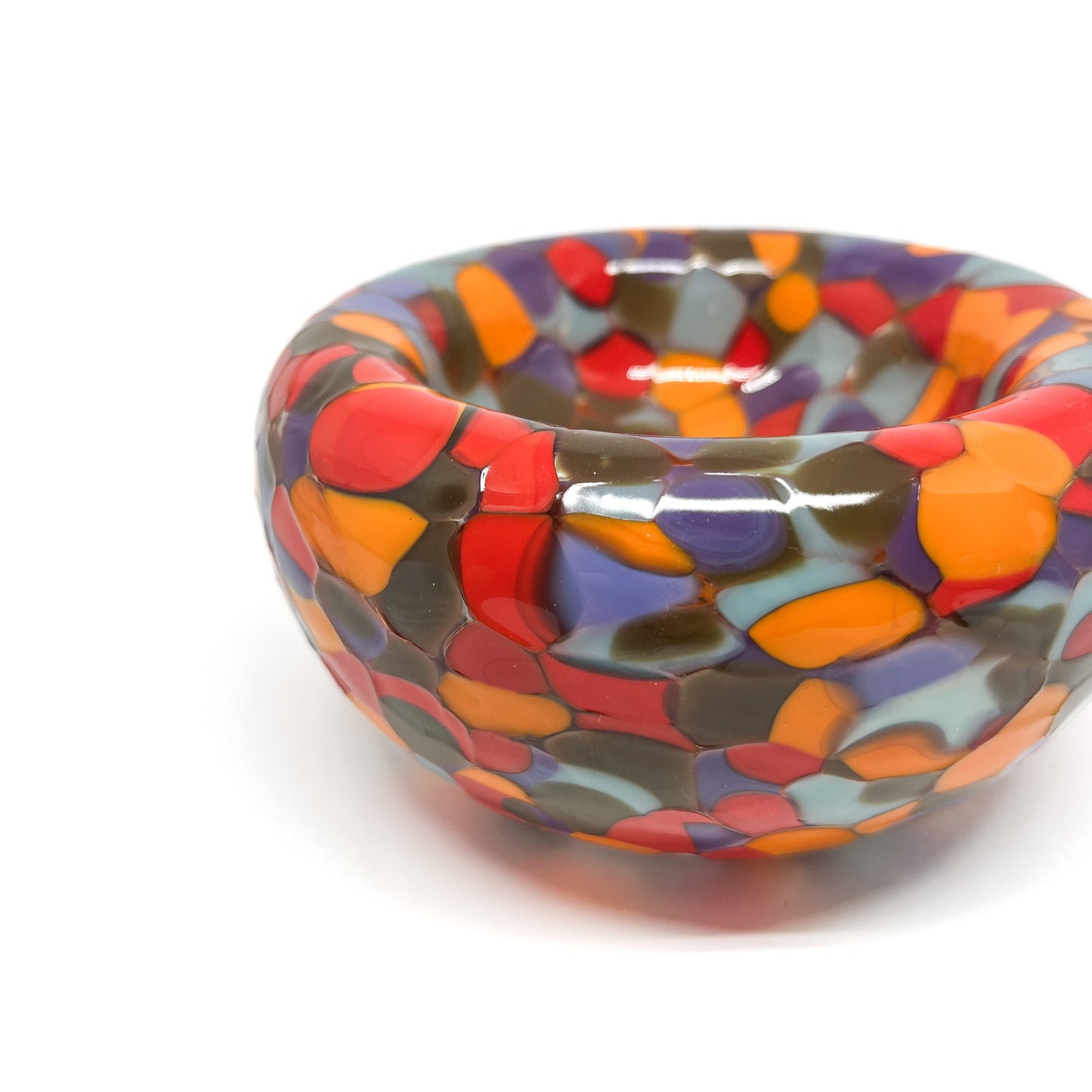 Detail of red-multicolor Blotched Nest Bowl showing the textured, abstract glasswork.
