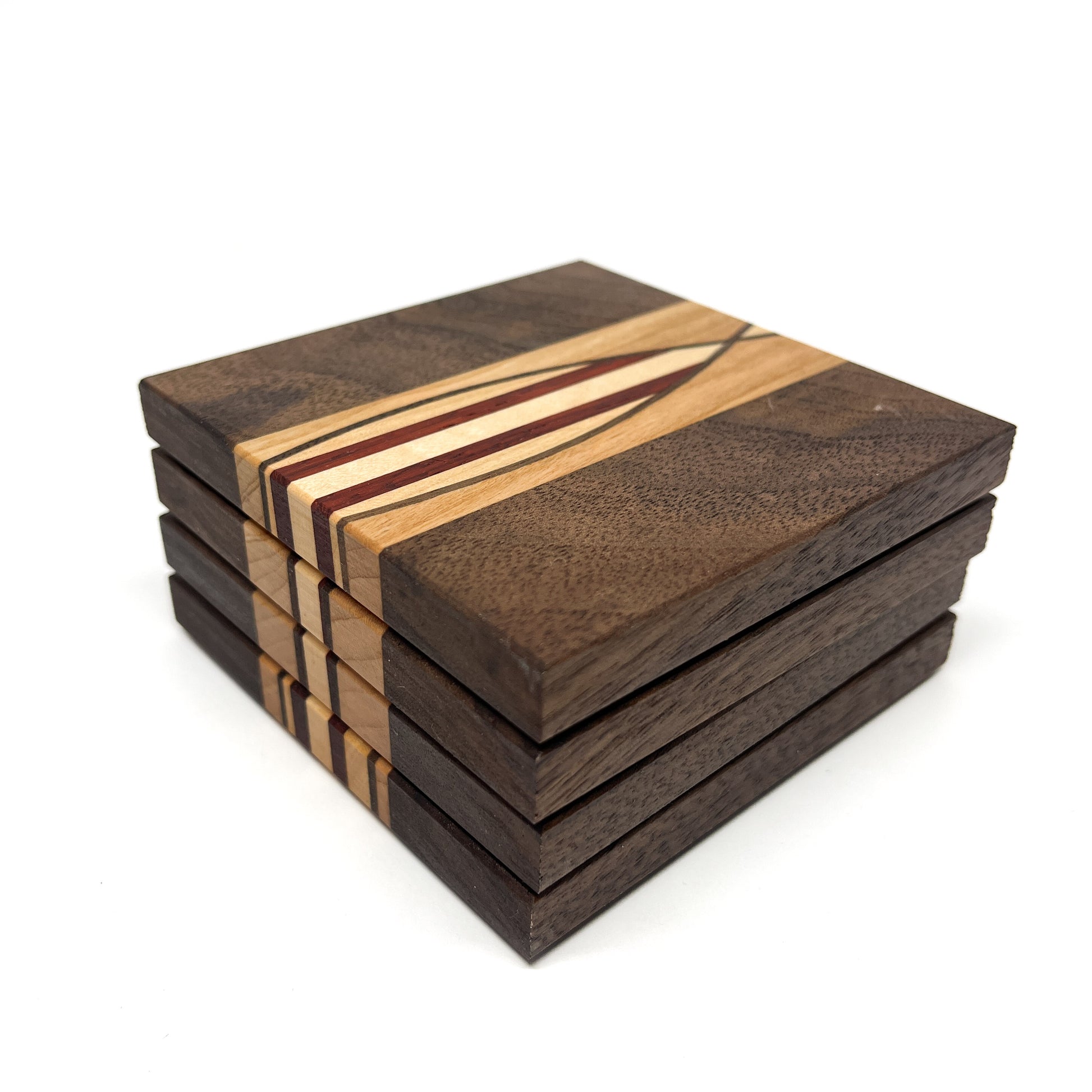 Stack of four dark wood coasters featuring a central surfboard-like inlay of lighter wood and red lines.