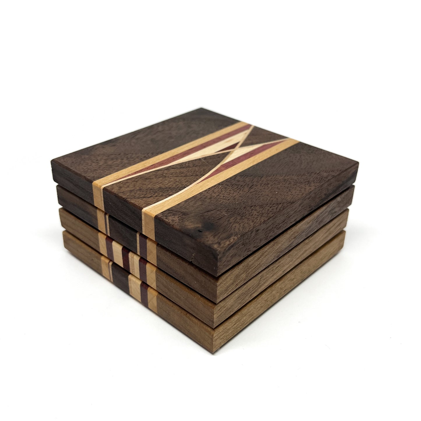 Stack of four dark wood coasters with a central geometric inlay of lighter wood and red accents.