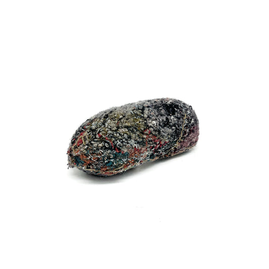 Embroidered Rock by Jane Kenyon: Oval textured textile art resembling a rock, with dense and varied colorful thread stitching.
