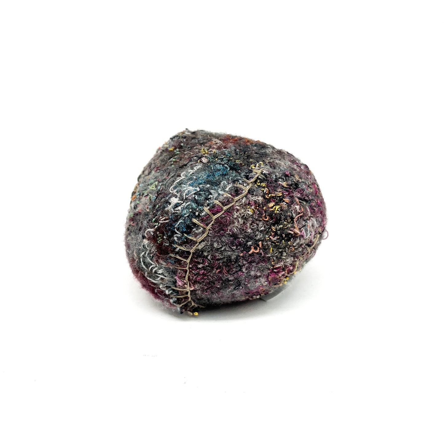 Embroidered Rock: Round textured textile art resembling a rock, with dense and colorful thread stitching.