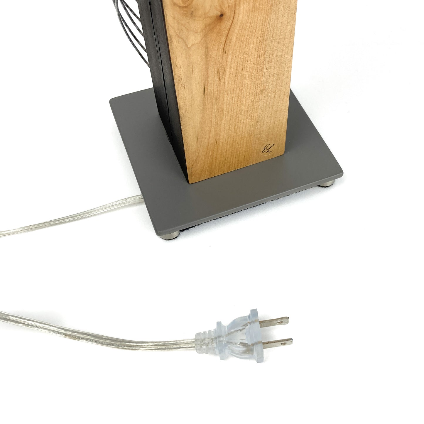 Lamp base with wood detail, gray base, power cord, and plug.
