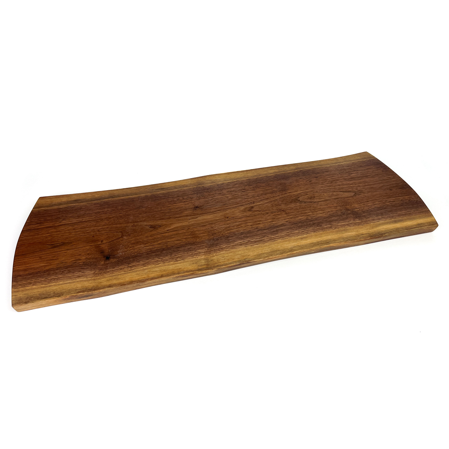 Angled view of a live edge wooden board showcasing its natural curves and grain.