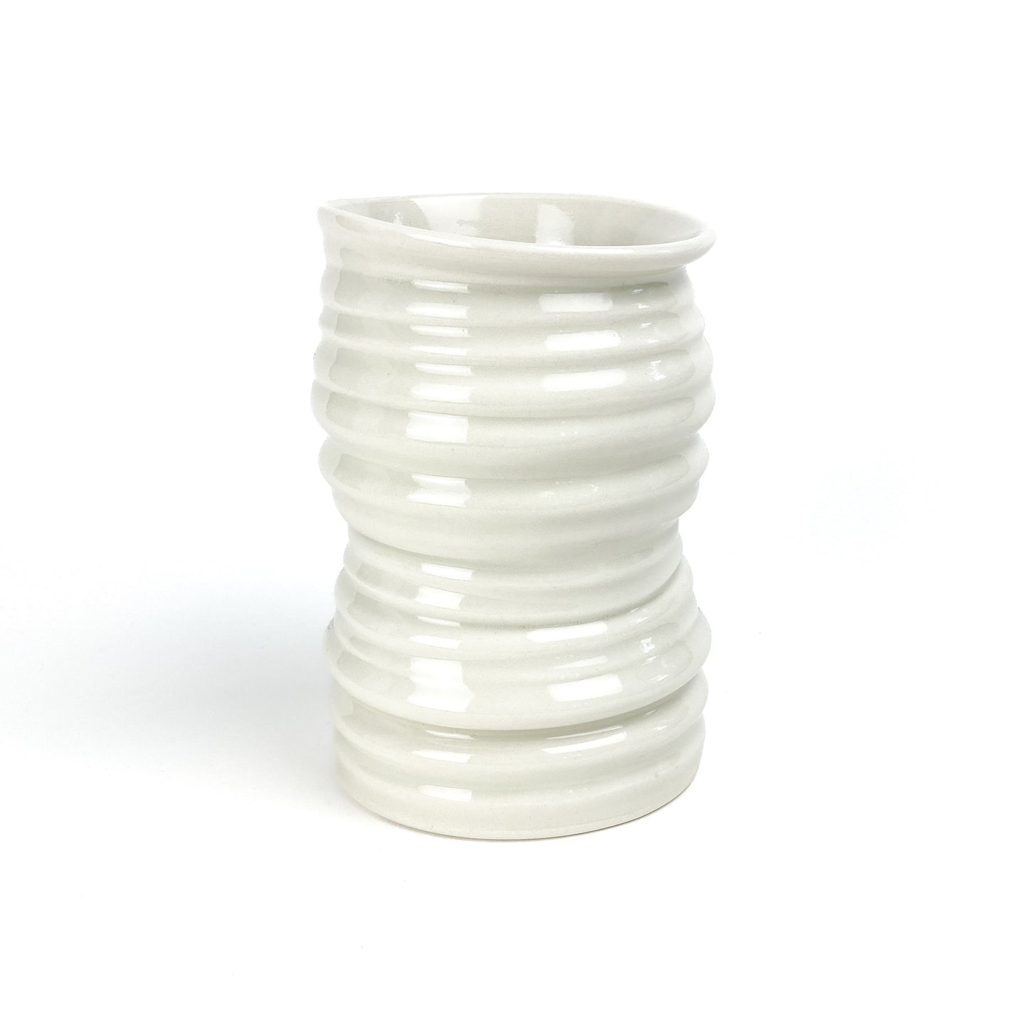 A cylindrical ceramic Yunomi tea cup with evenly spaced horizontal ridges and a slightly flared rim.