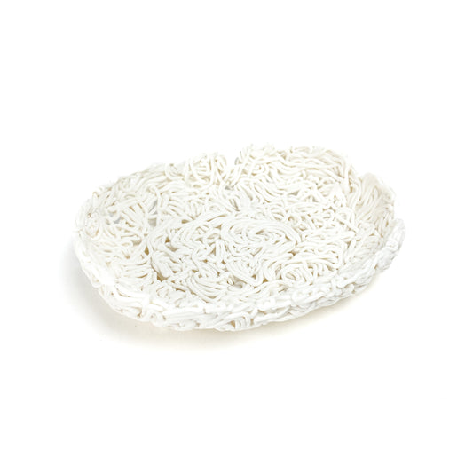 A textured, shallow ceramic decorative bowl with an intricate, tangled web-like design.