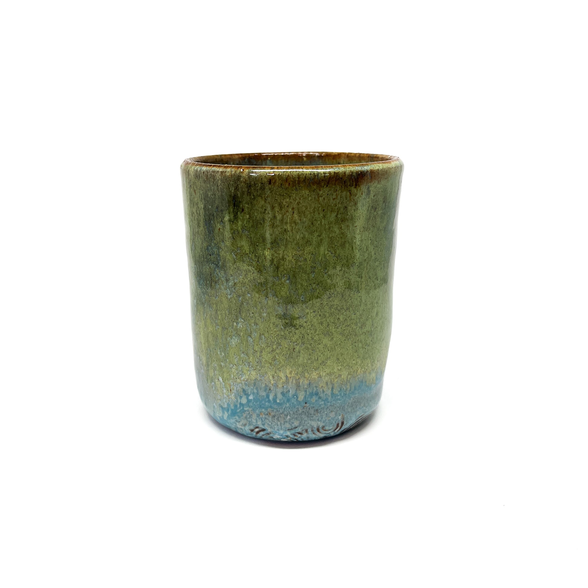 One glazed green terracotta cup.
