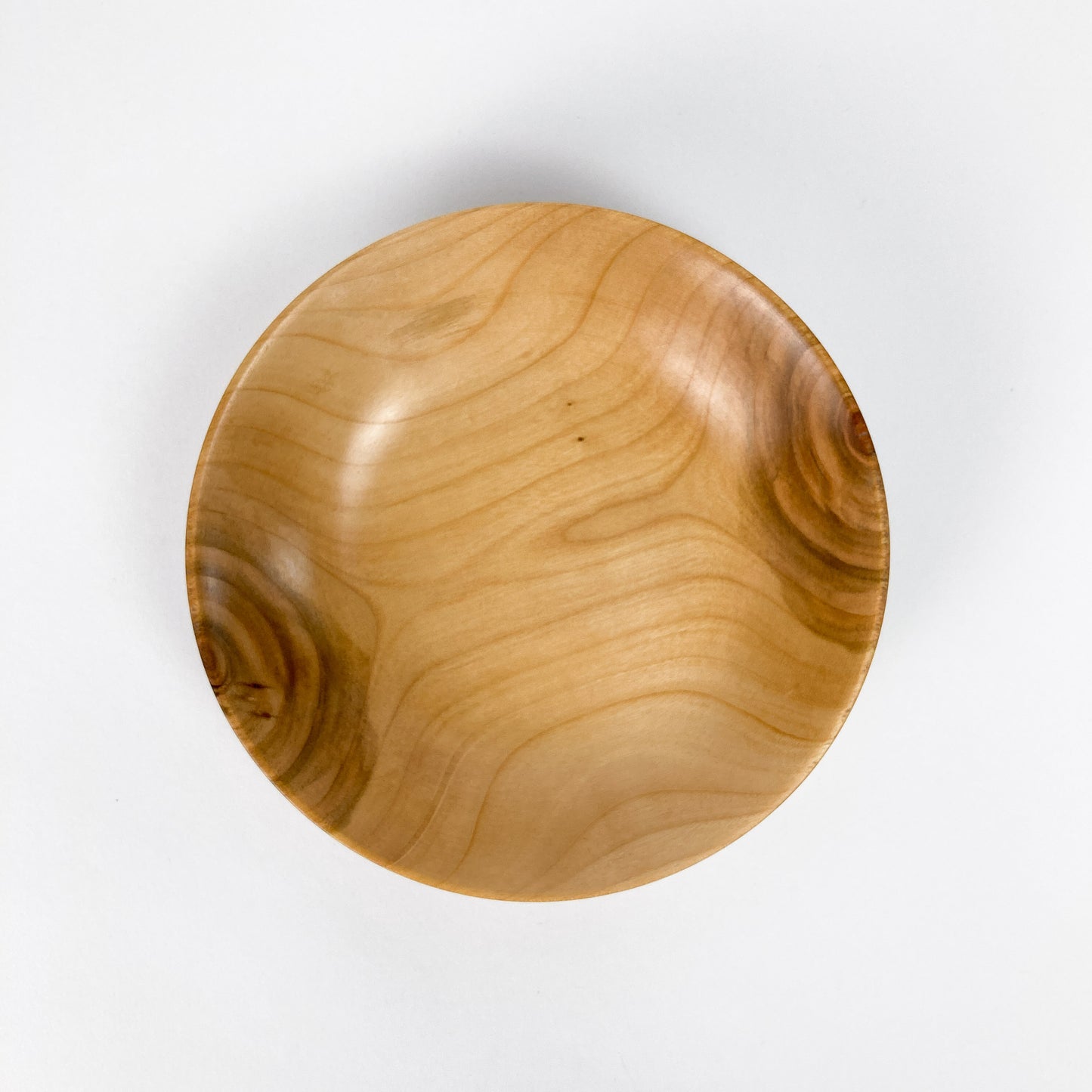 An overhead view of a Big Leaf Maple Candy Bowl, highlighting the unique patterns of the wood grain.