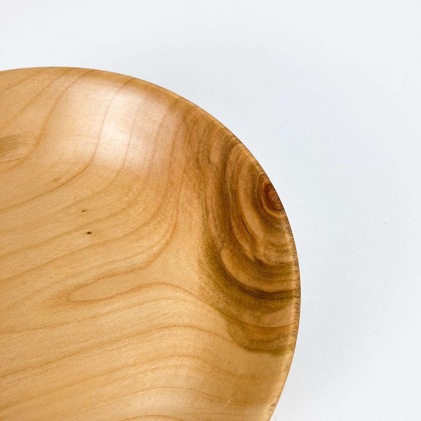 A close-up of the rim of a Big Leaf Maple Candy Bowl, showing the polished edge and subtle wood variations.