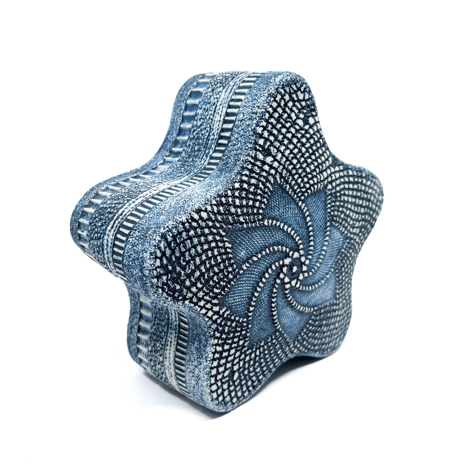 Intricately patterned Blue Oxide Diatom Star Sculpture with a swirling center and textured edges.