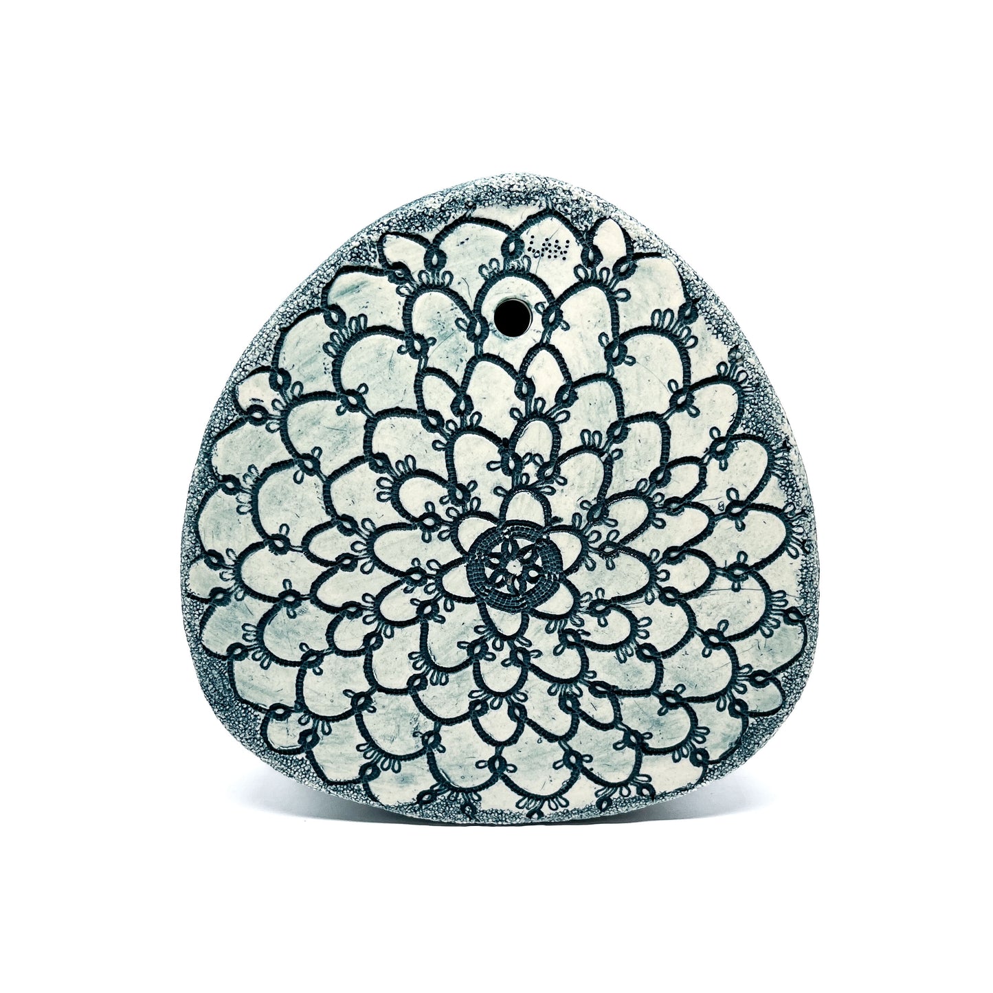 Top view of a Green Oxide Triangle Diatom Sculpture, showcasing its intricate, symmetrical floral-like pattern.