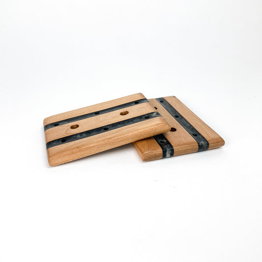 Two stacked Tuxedo Soap Trays featuring resin inlays and drainage holes in a modern, handcrafted design.