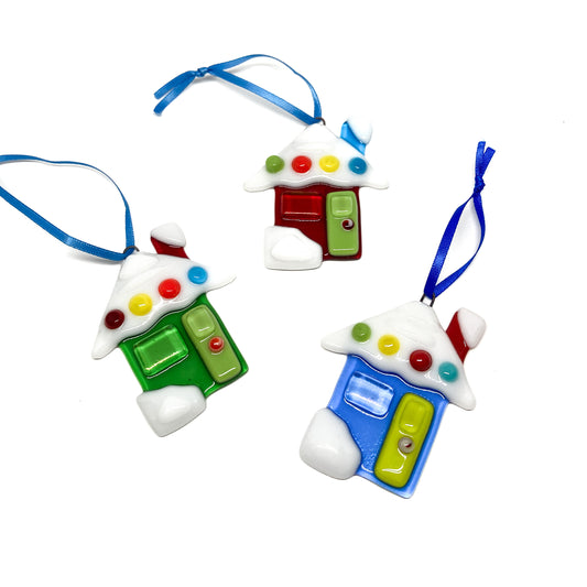 Three glass house ornaments with colorful details and blue ribbons.